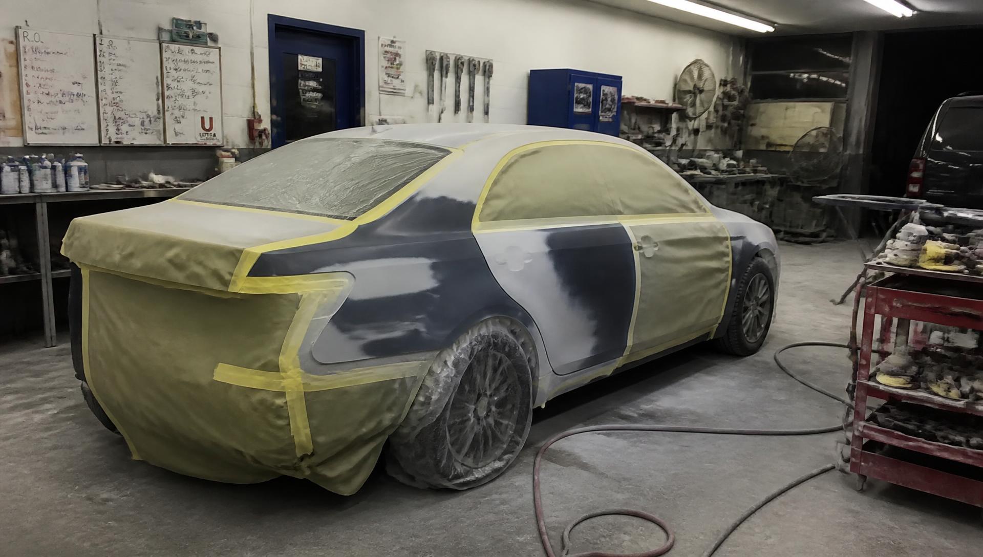 Car masked off for paint work inside the Two Brothers Auto Body shop in Englewood NJ